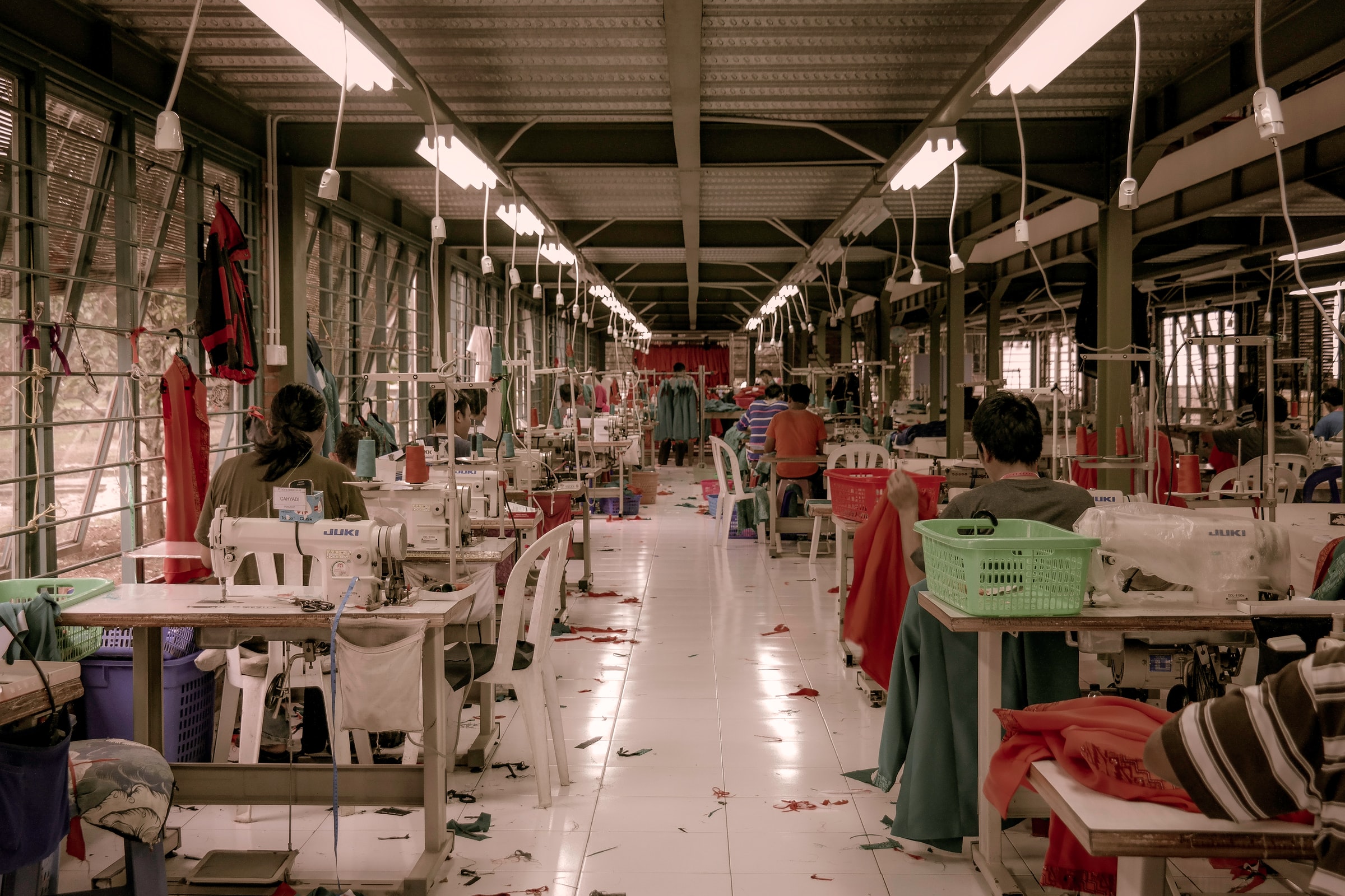 People working in a fashion factory making clothes